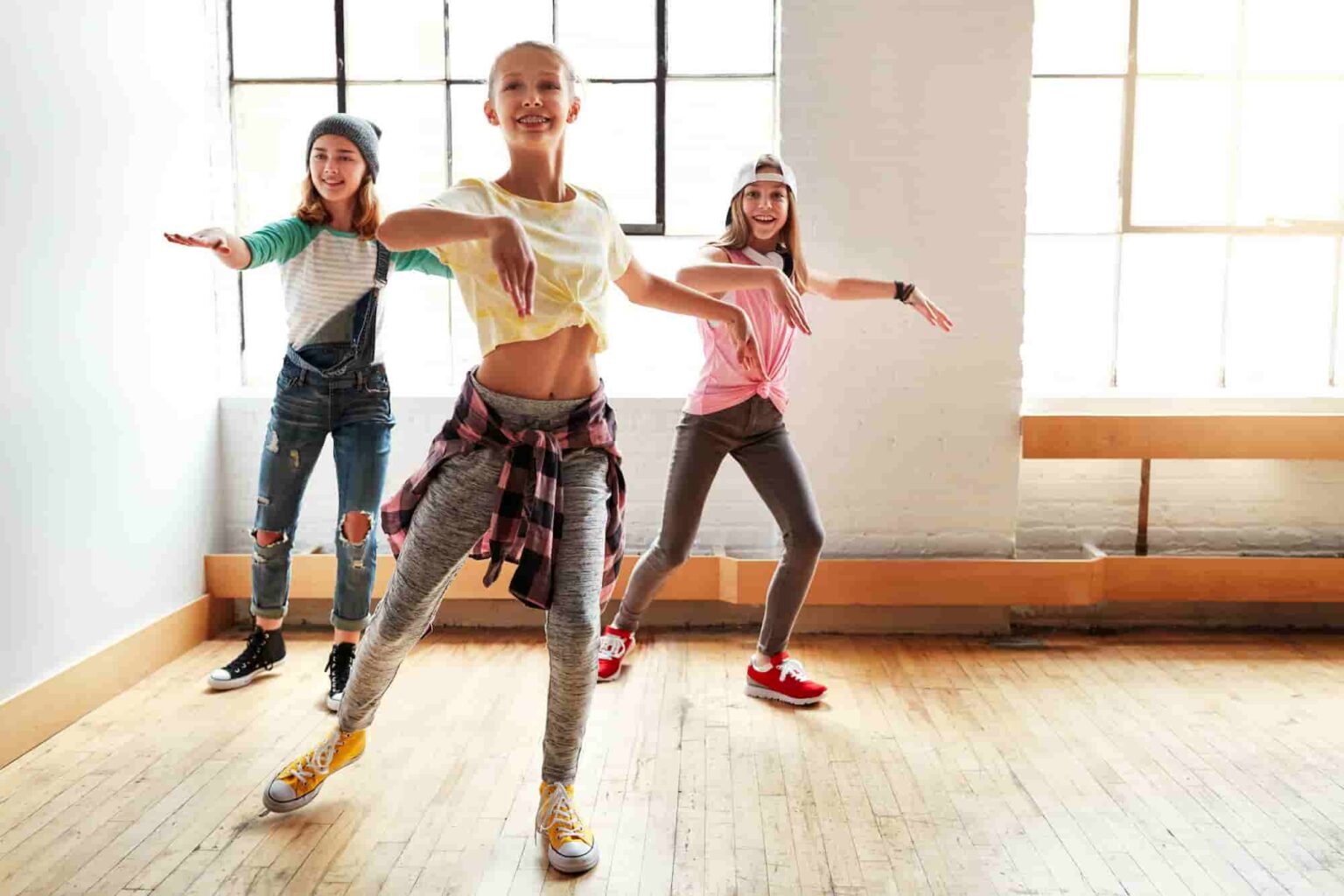 Teenagers dancing together in a studio, an activity that can earn experiential learning credit