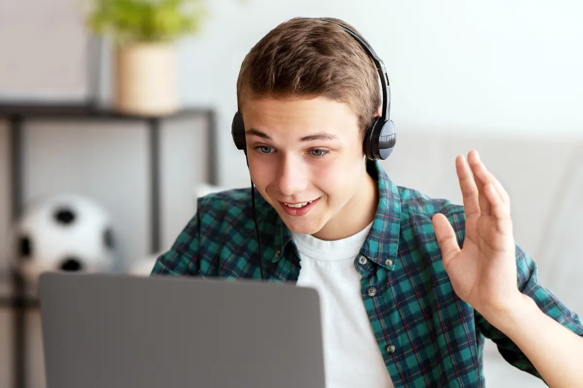 Student on a video call with an Academic Mentor during an online school check-in